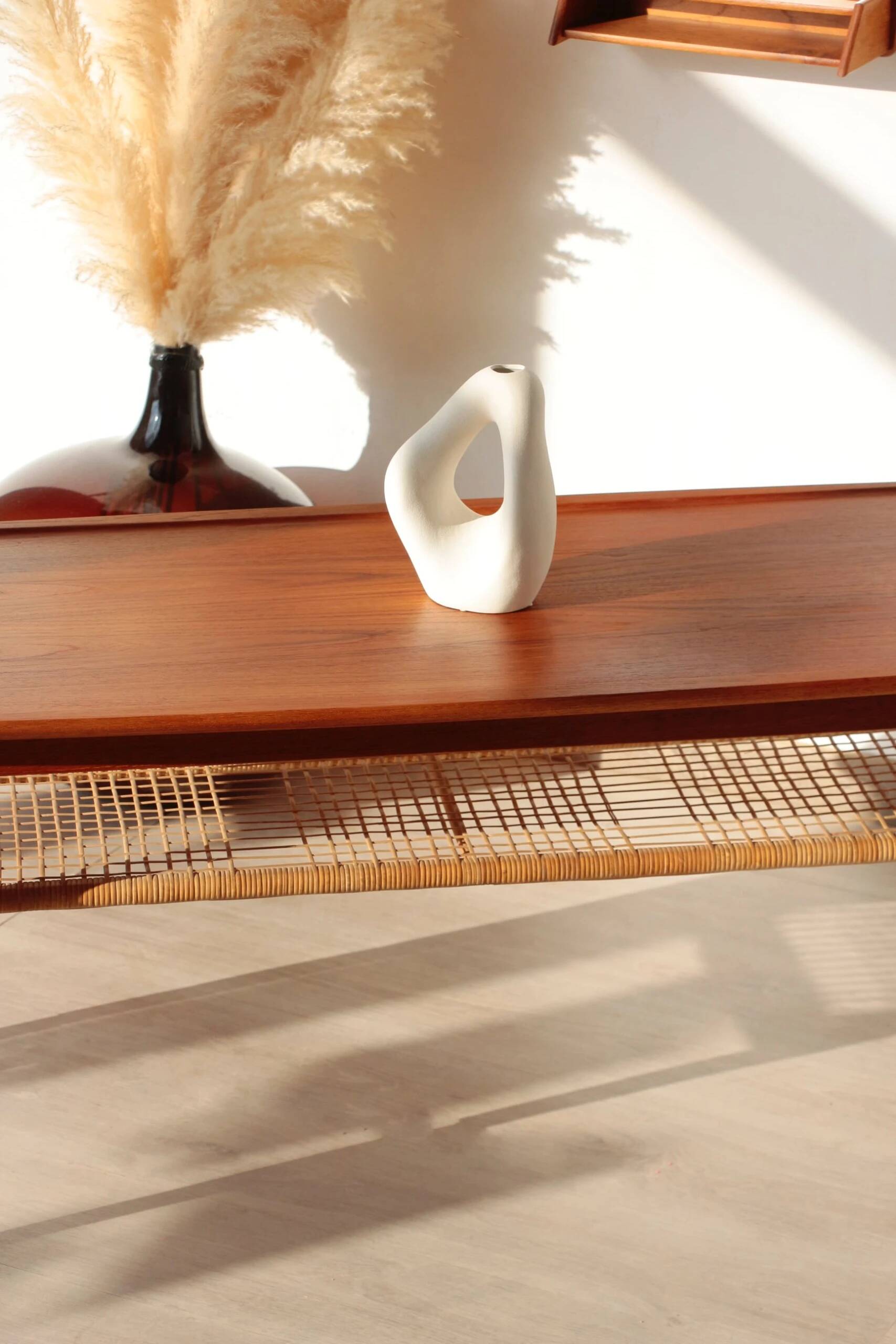 Vintage Scandinavian coffee table in teak and rattan – Danish design from the 1960s.