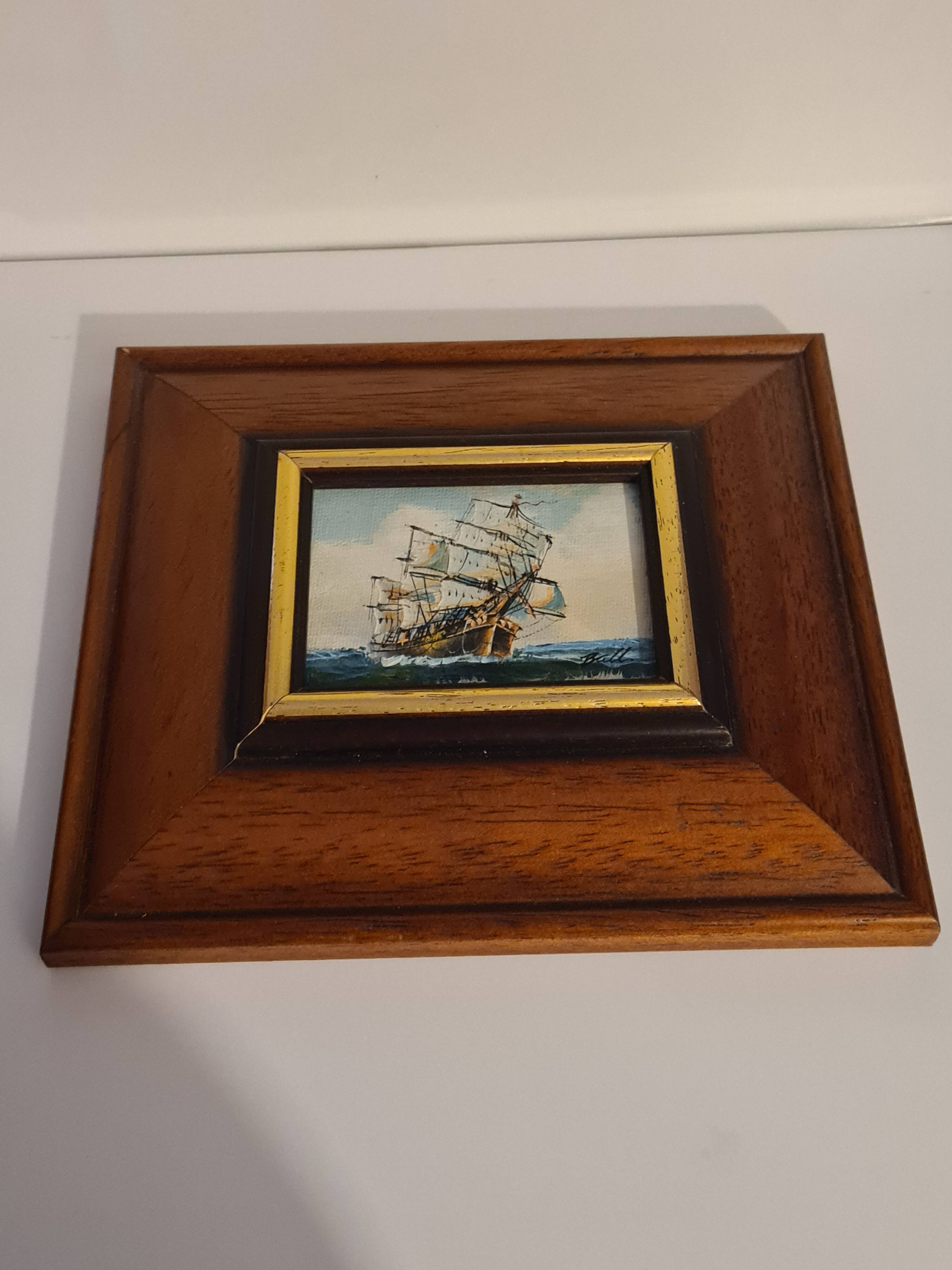 Wooden frame with boat decor