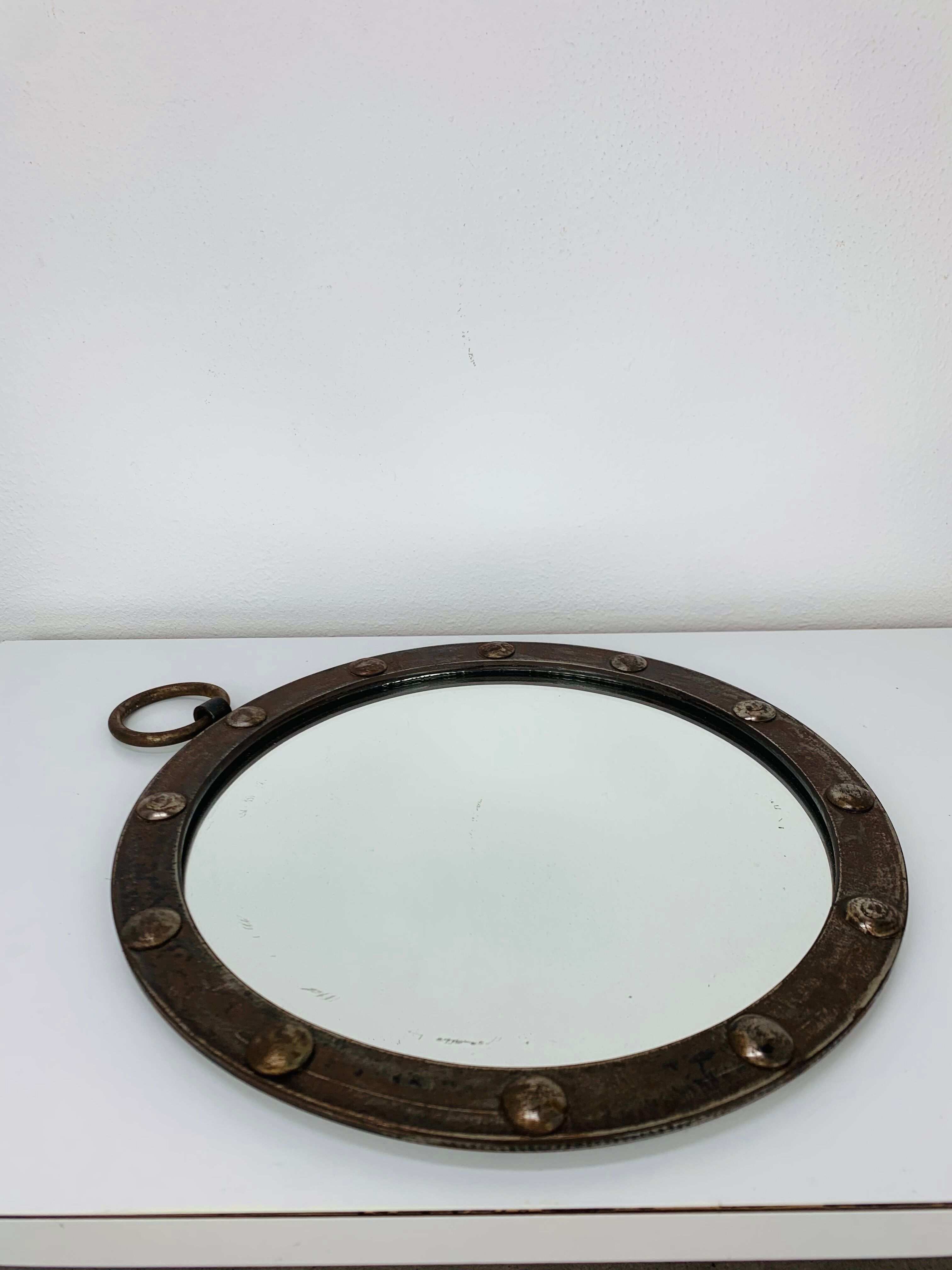 Round wrought iron porthole mirror