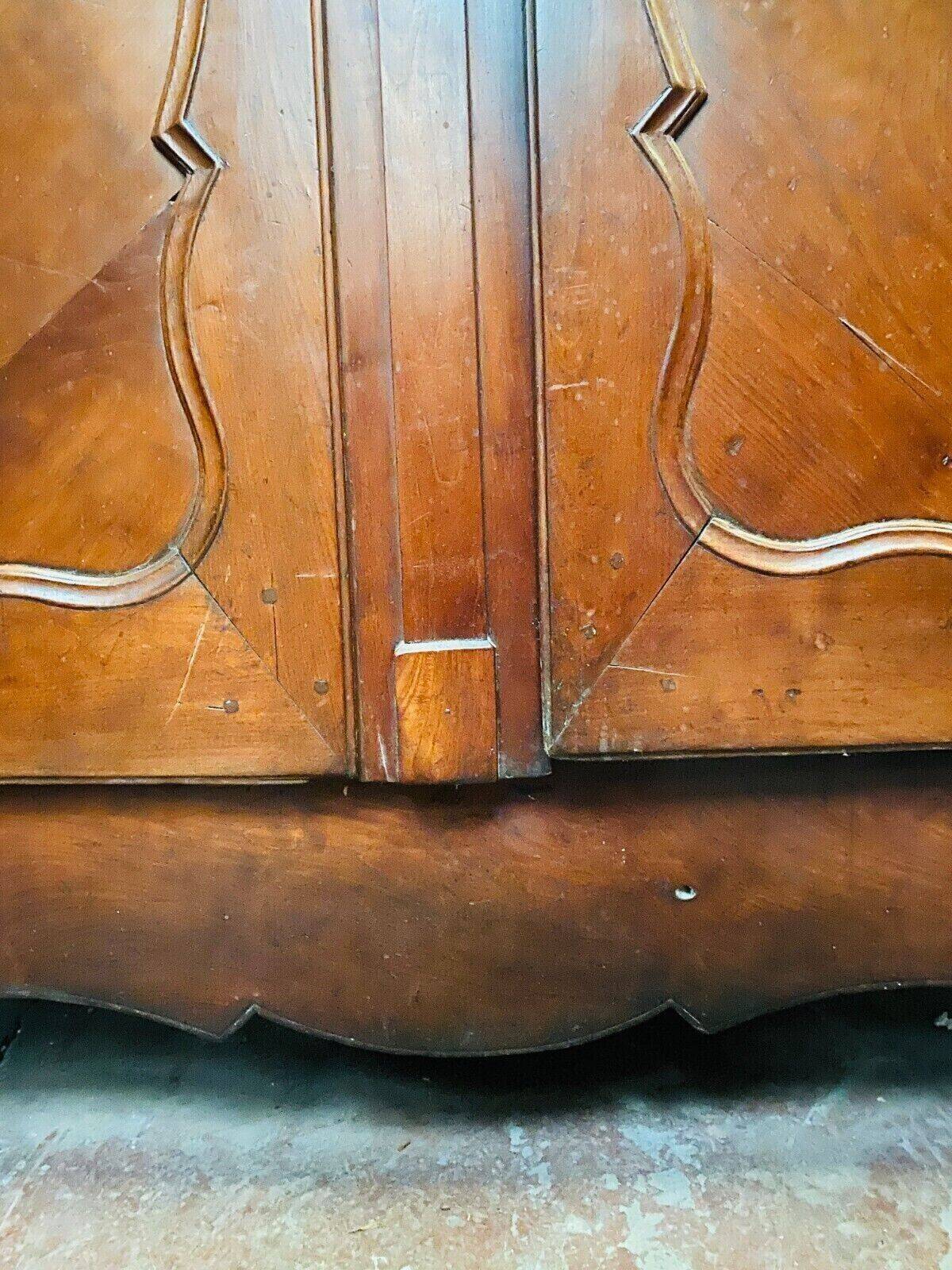 Louis XV armoire with gendarme's hat in solid cherry wood, 18th century