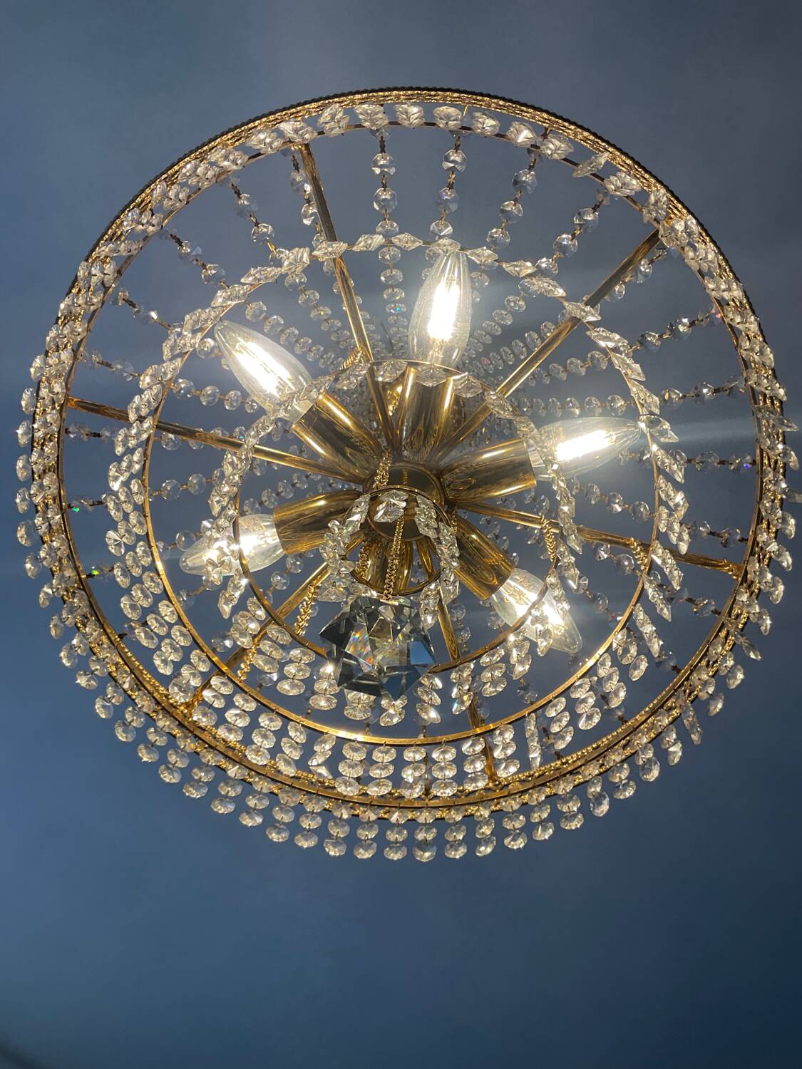 Brass hot air balloon chandelier with cascade of tassels