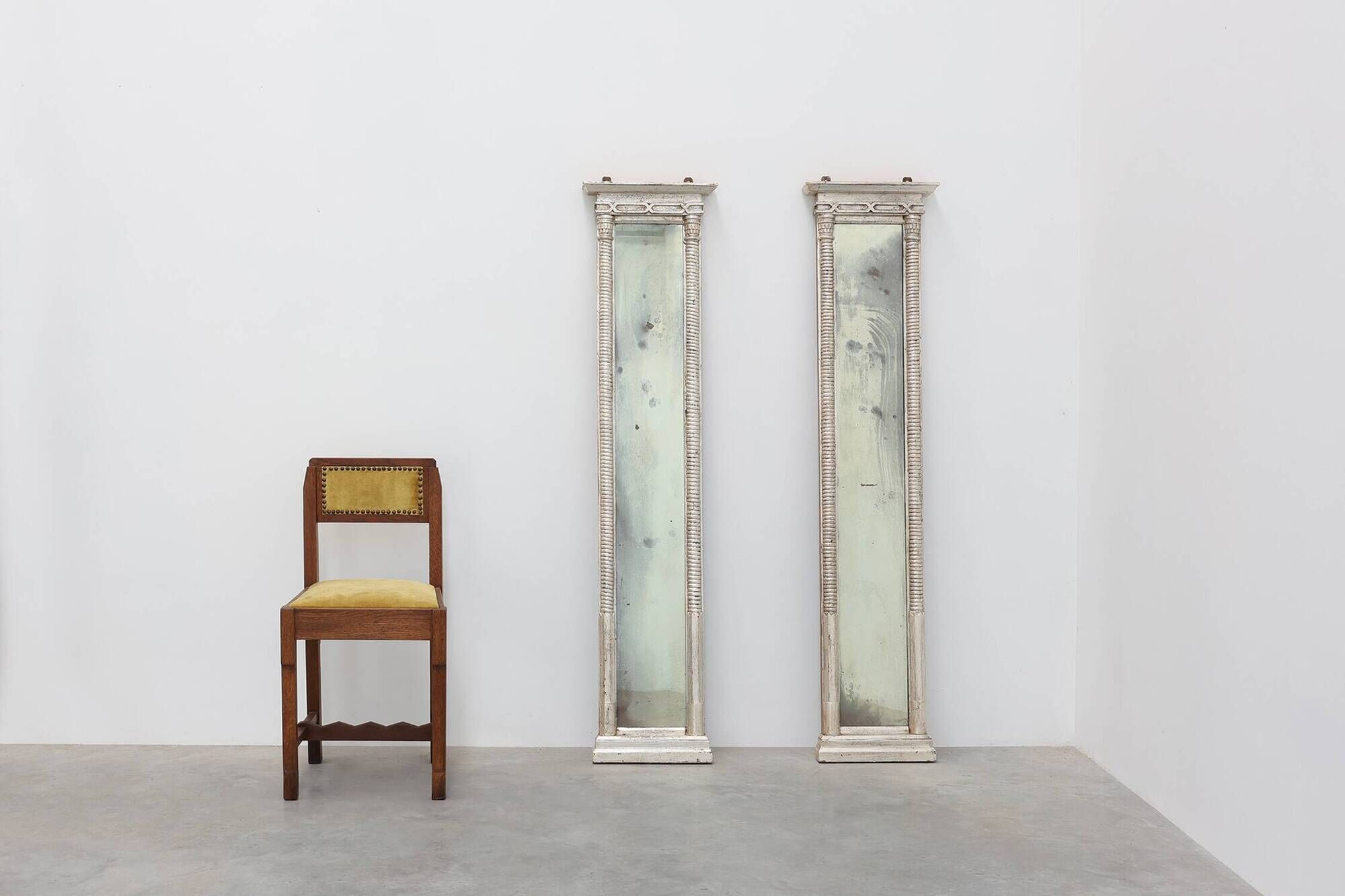 Pair of Neoclassical Silver Leaf Pier Mirrors with Ringed Columns and Corni