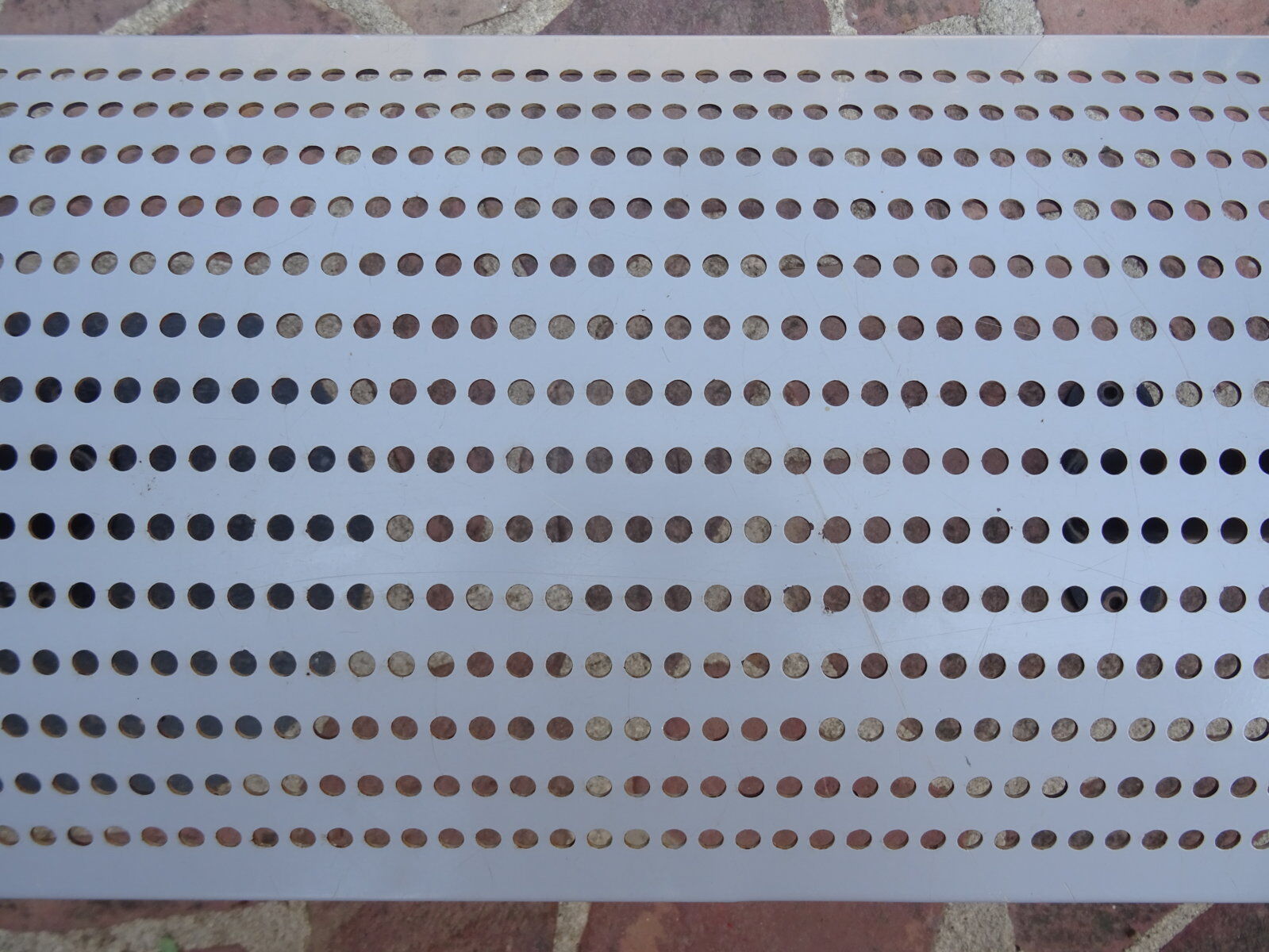 Perforated metal bench