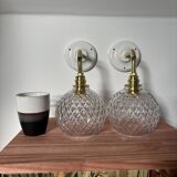 Pair of chiseled glass globe wall sconces