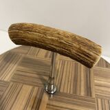 Vintage round wooden cheese board covered with glass plate with foldable handle