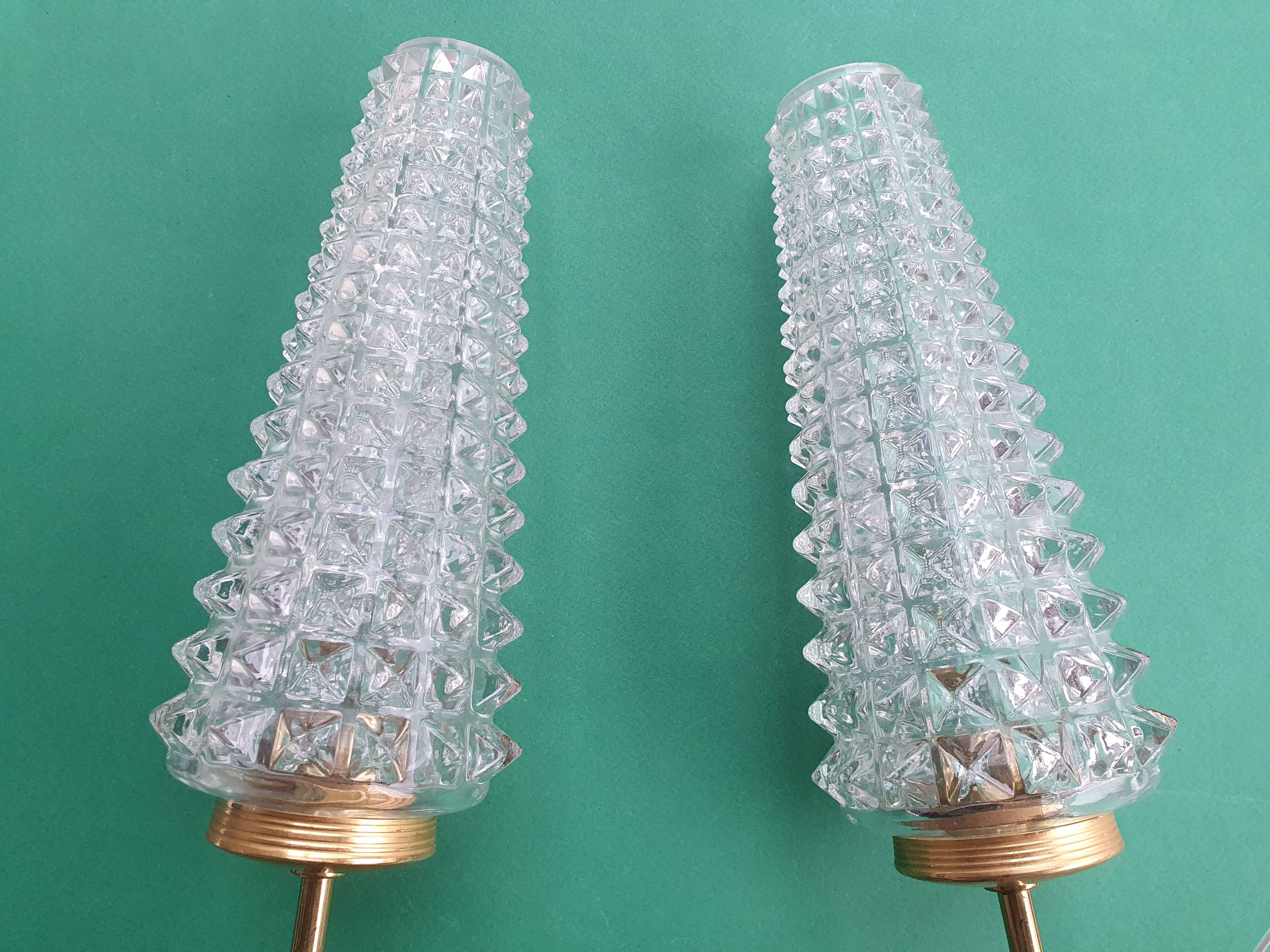 Pair of large gold wall lights with tulip-shaped globes by Arlus