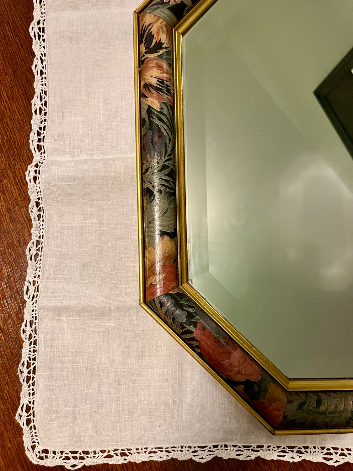 Vintage beveled mirror with floral frame