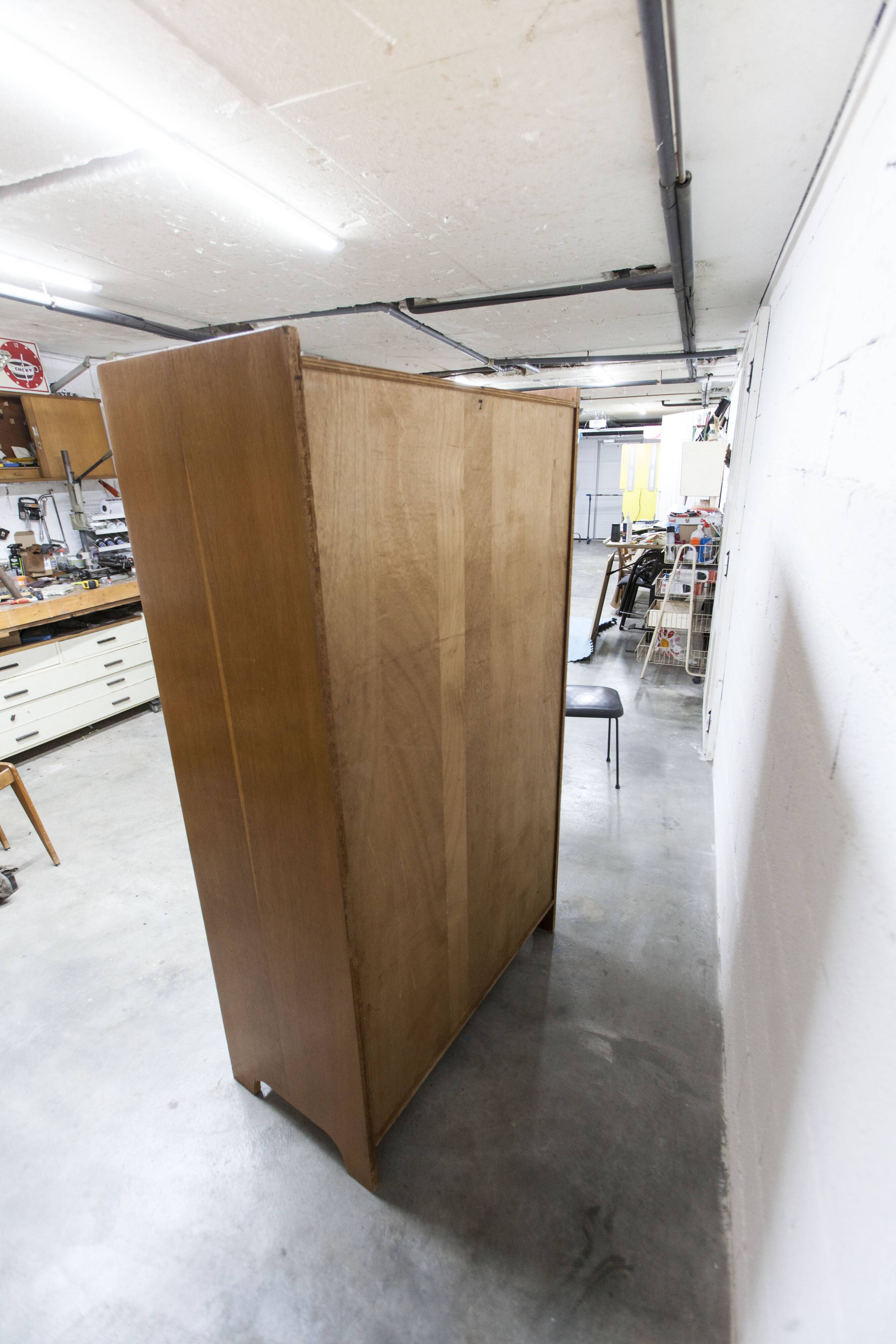 1950s Mid-Century Modern oak armoire with two doors and two drawers.