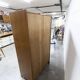 1950s Mid-Century Modern oak armoire with two doors and two drawers.