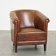 Neat, elegantly finished, cozy sheepskin club armchair with a fixed seat cushion