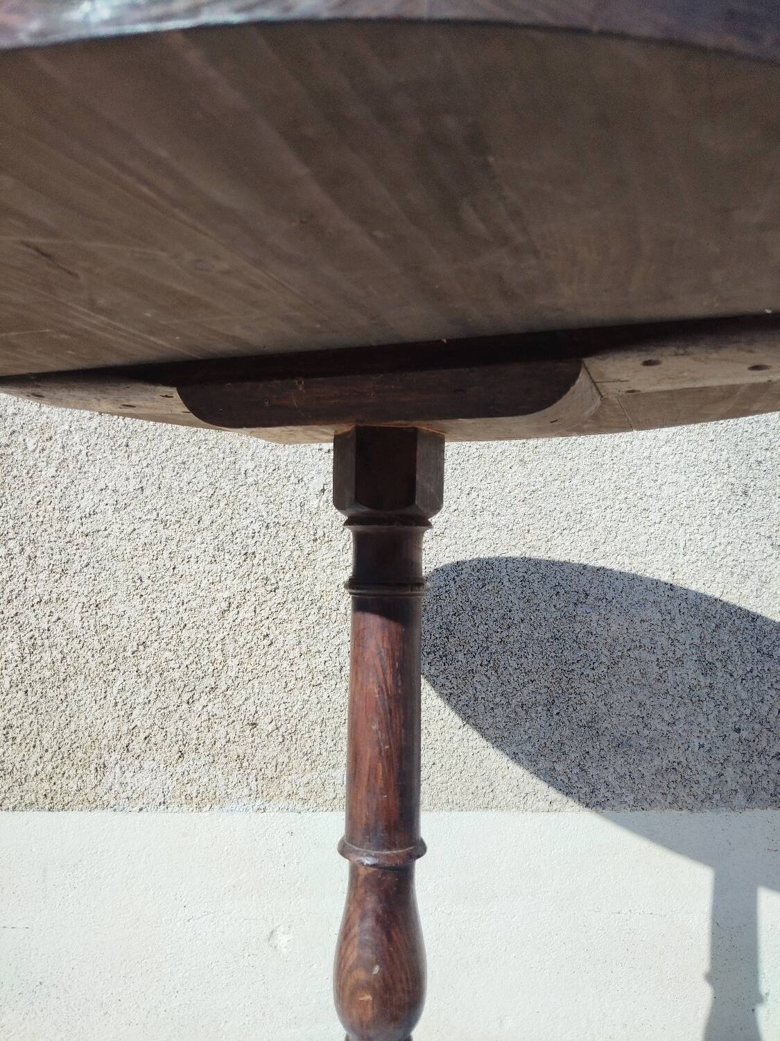 Small rustic antique tripod side table made of solid wood.