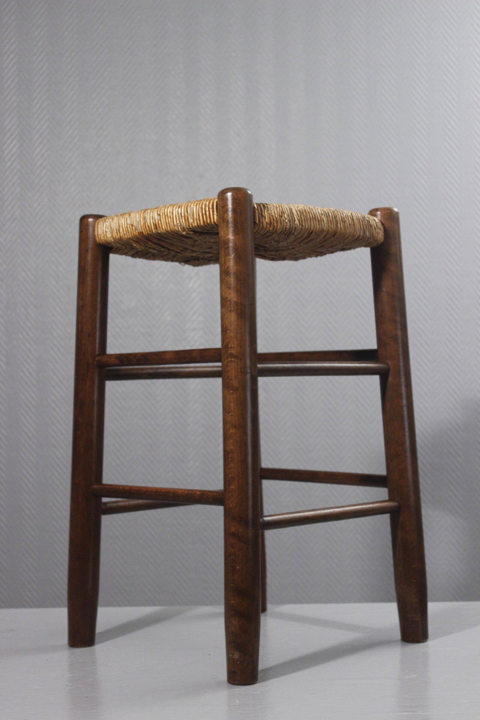 Vintage straw stool in the style of Charlotte Perriand, 1970s.