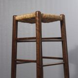 Vintage straw stool in the style of Charlotte Perriand, 1970s.