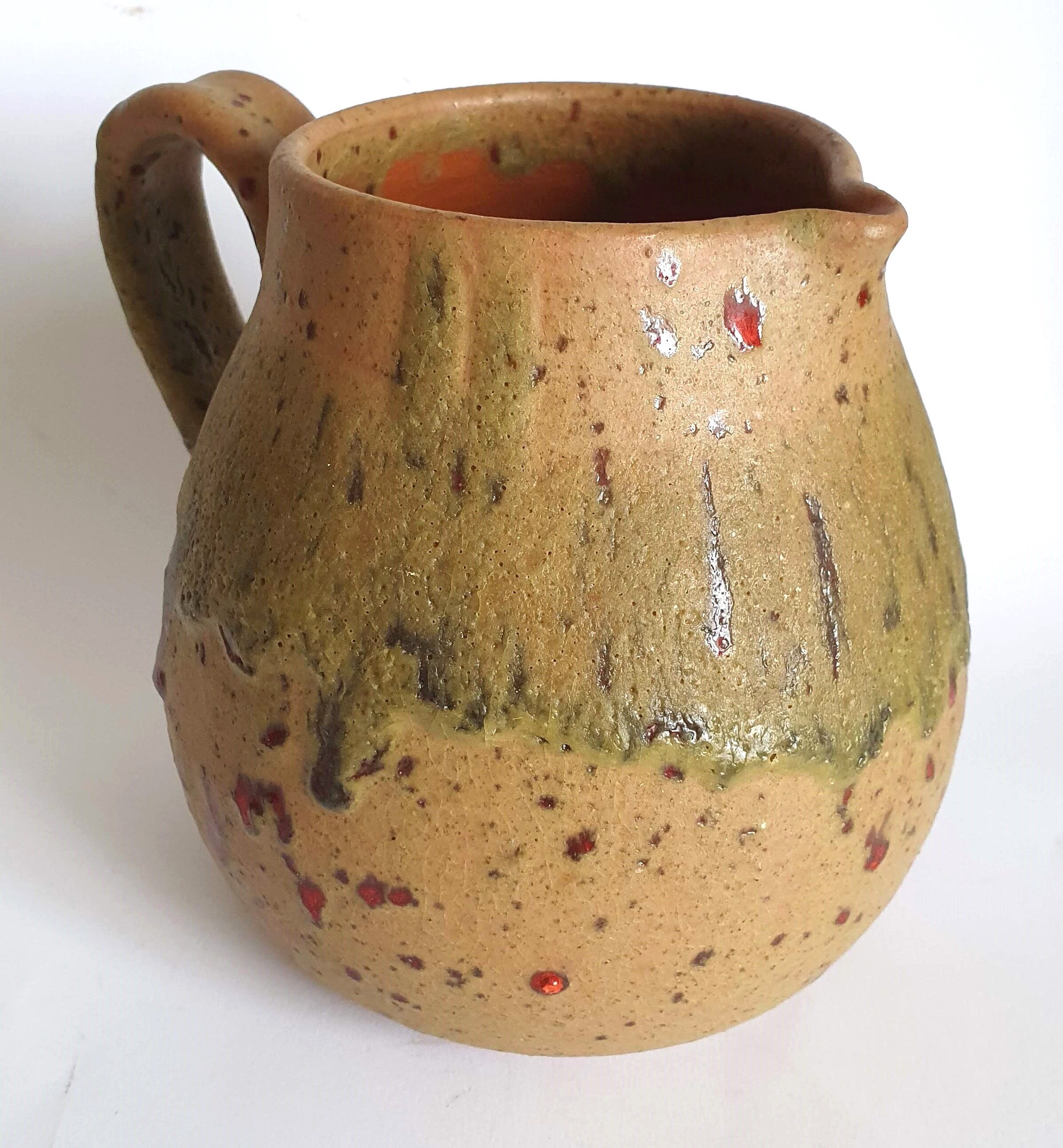 Red speckled stoneware pitcher by Campo Piano Orezza