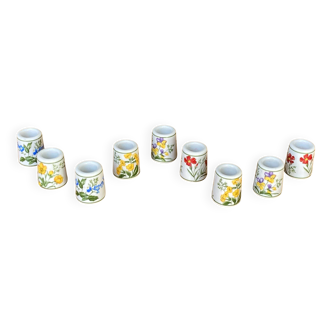 Set of 9 mini vintage porcelain candle holders decorated with spring flowers.