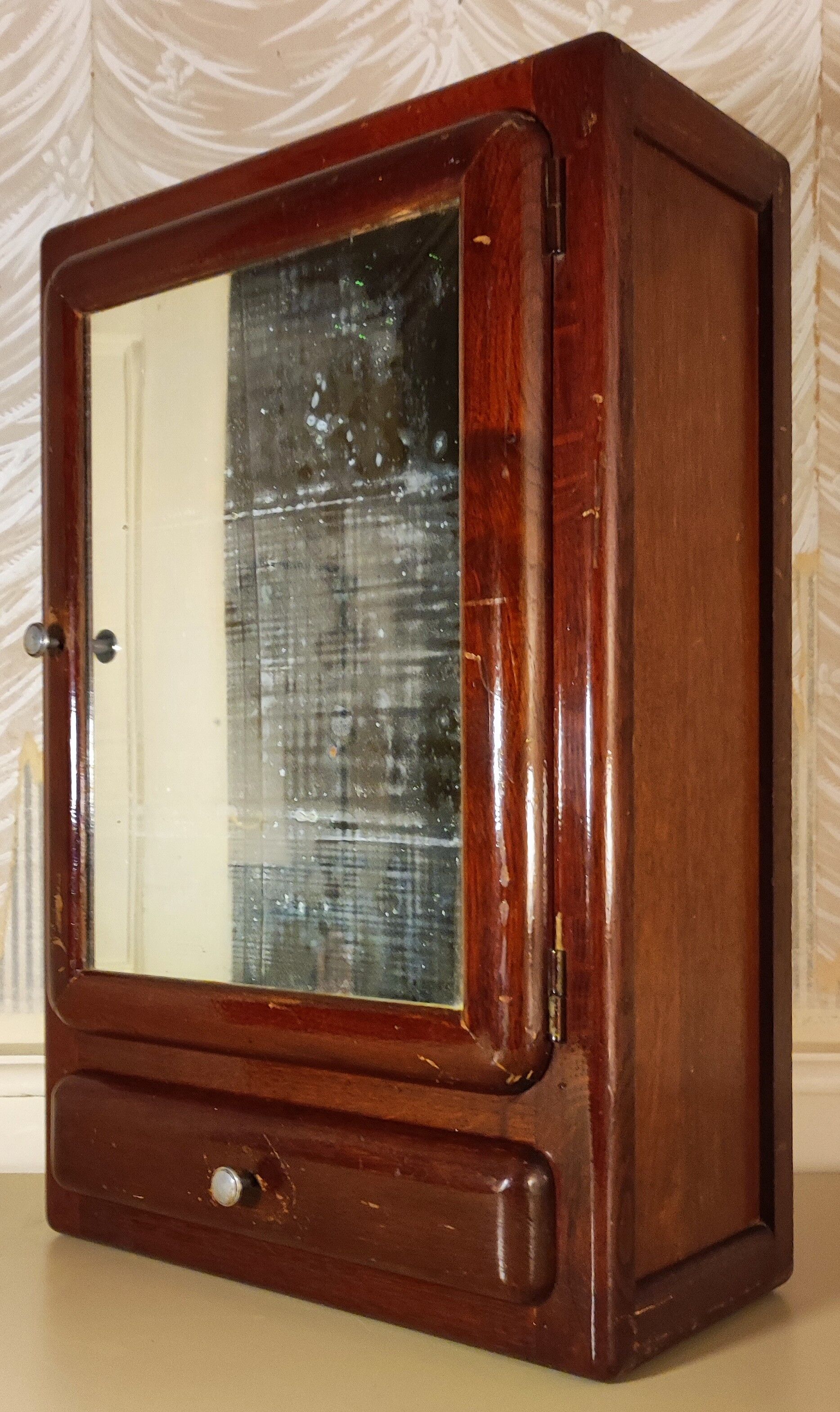 Wall-mounted medicine cabinet circa 1940