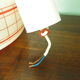 Space age pendant lamp, white opaline with orange silkscreened geometric designs