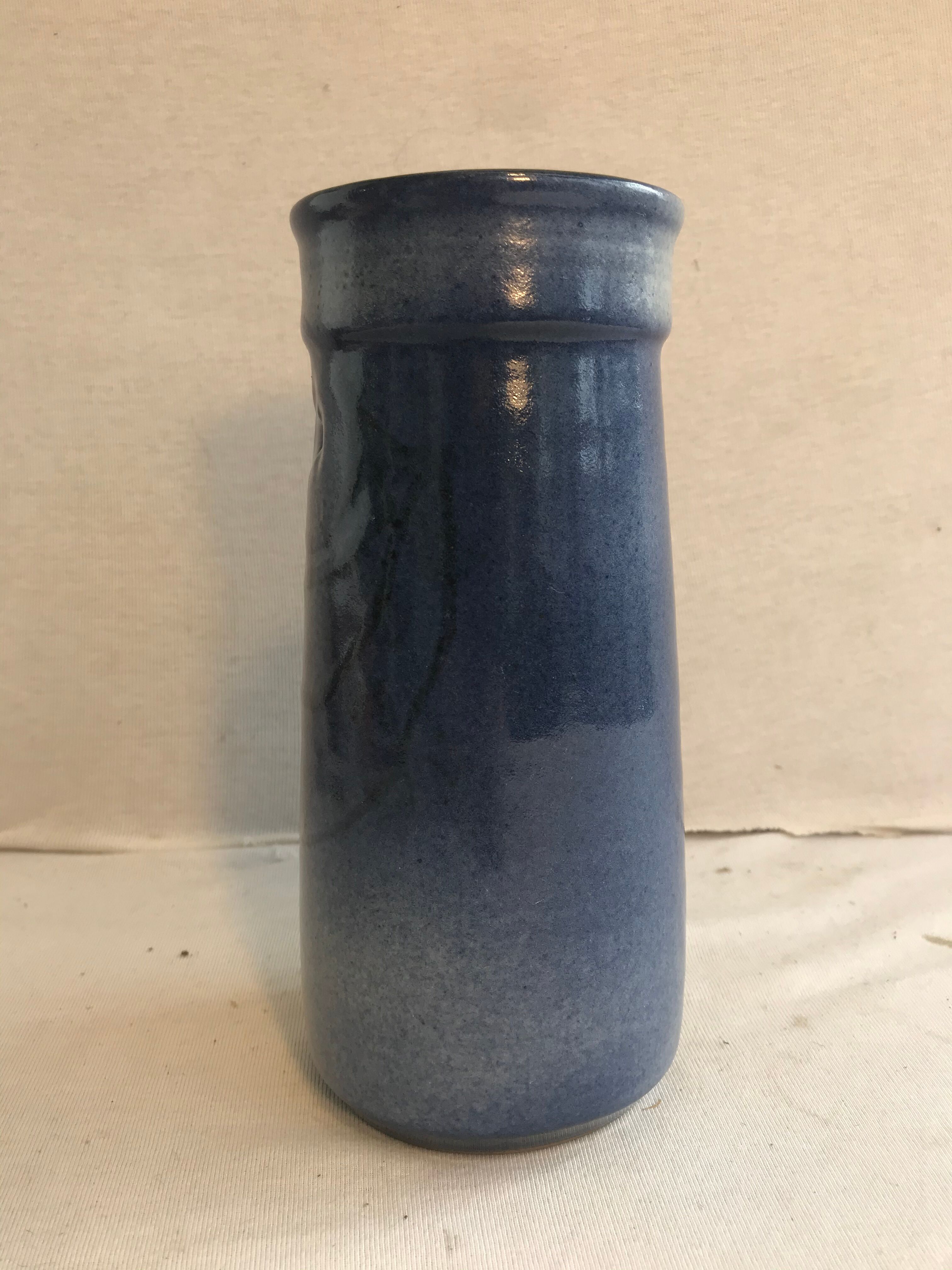 Old roll vase in blue sandstone