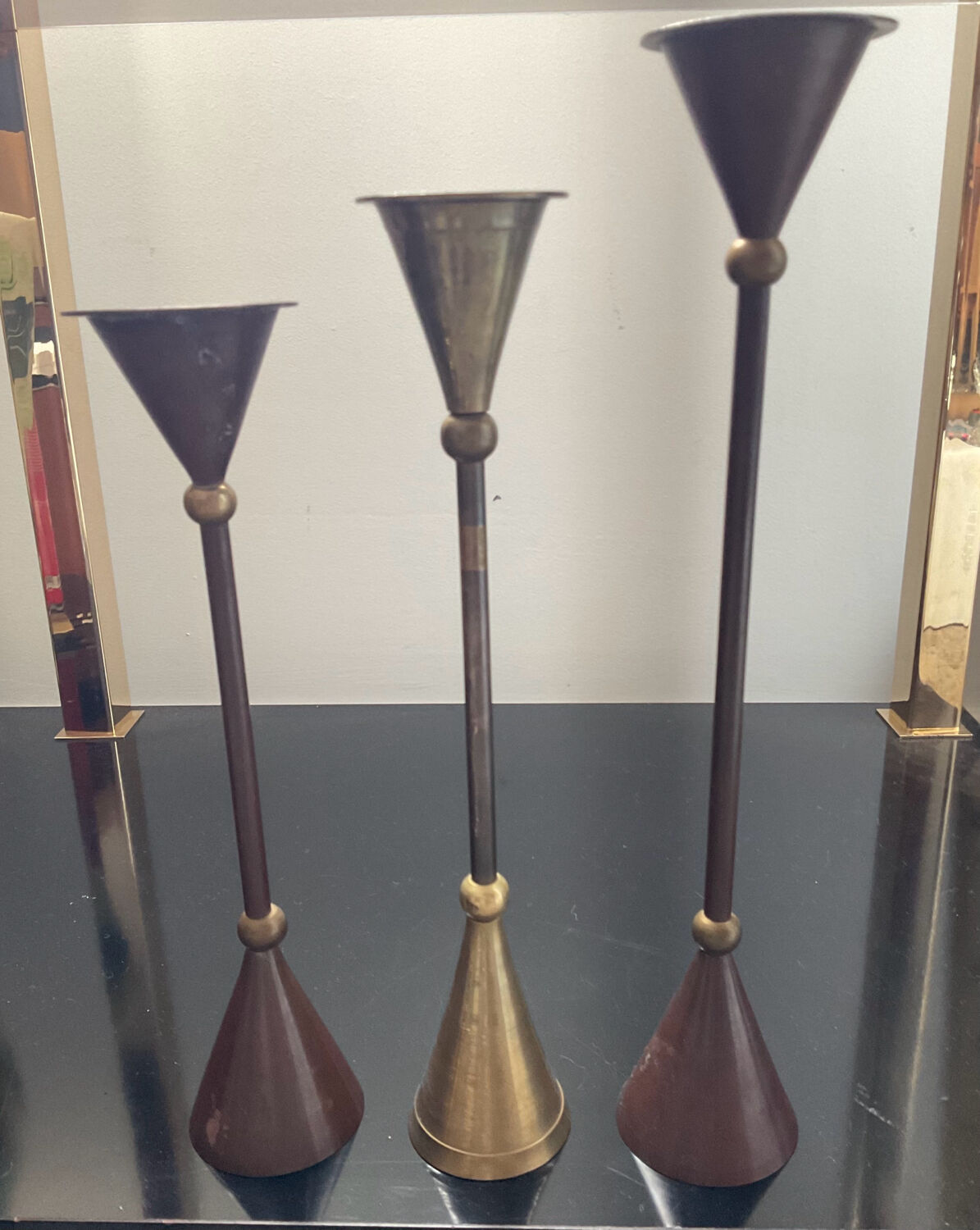 Trio of vintage brass and copper candle holders