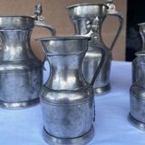 6 pewter pitchers