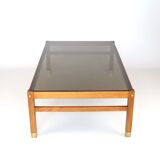 Table basse en palissandre et verre fumé