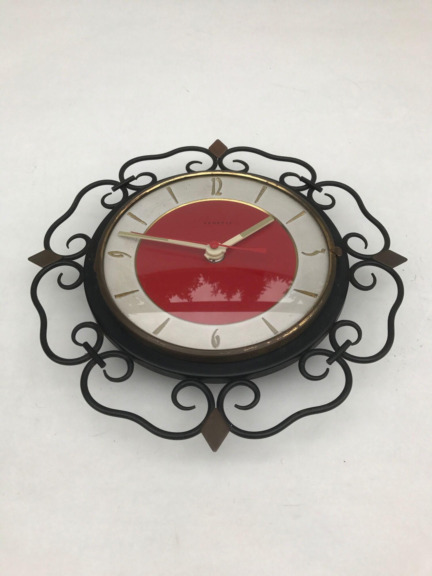 Pendulum clock old featured in metal and vintage copper spikes
