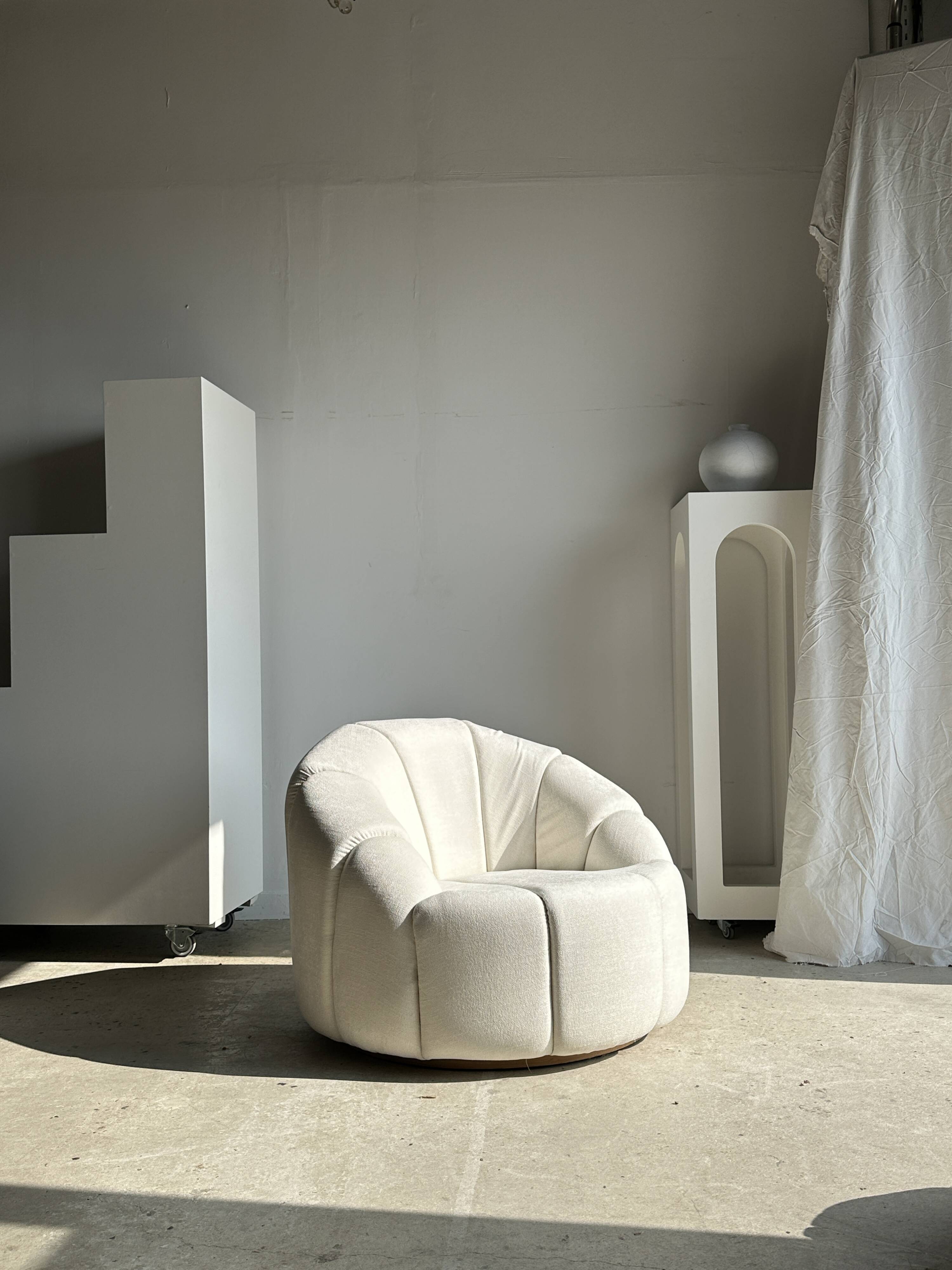 Large white circular armchair, white fabric upholstery