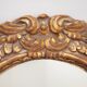 Oval mirror in gilded and carved wood. Vintage mirror. Wall mirror.