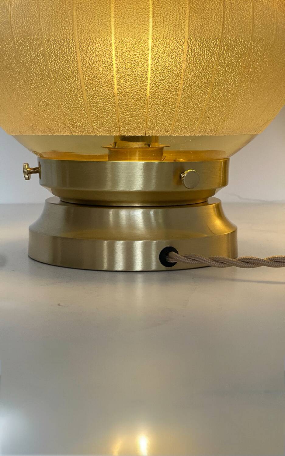 Pair of large art deco globe table lamps with brass legs