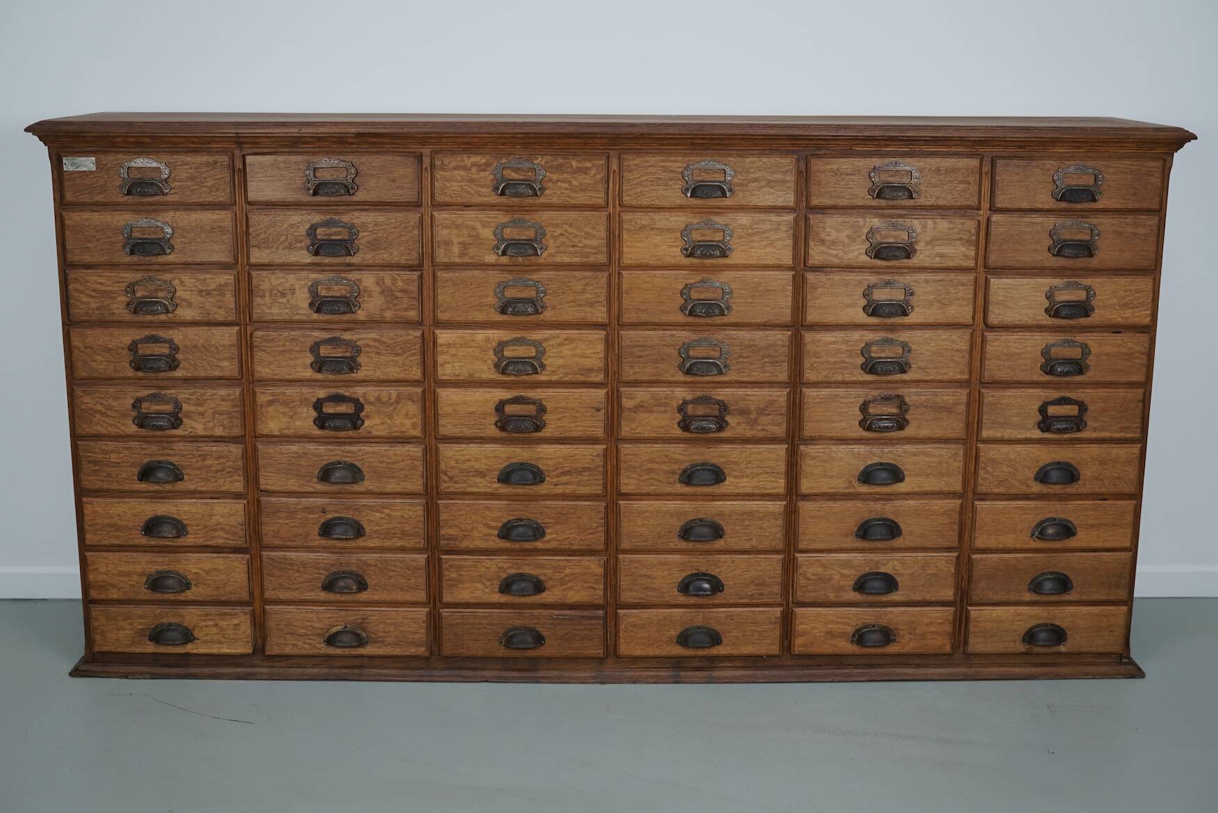 Antique French oak filing / apothecary cabinet by Chouanard, ca 1910