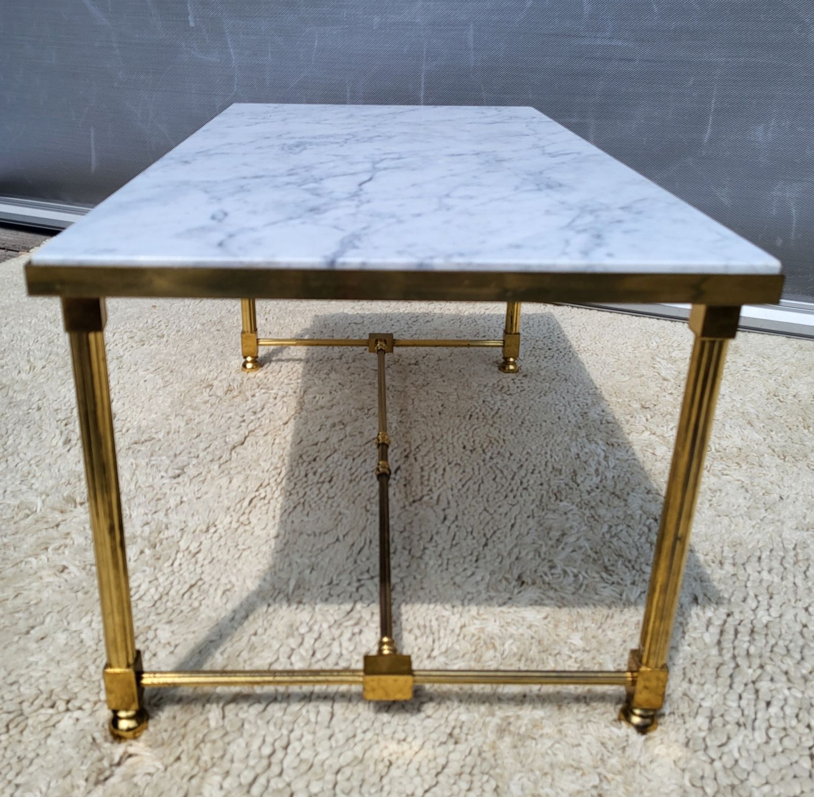 Hollywood Regency style coffee table • marble and brass