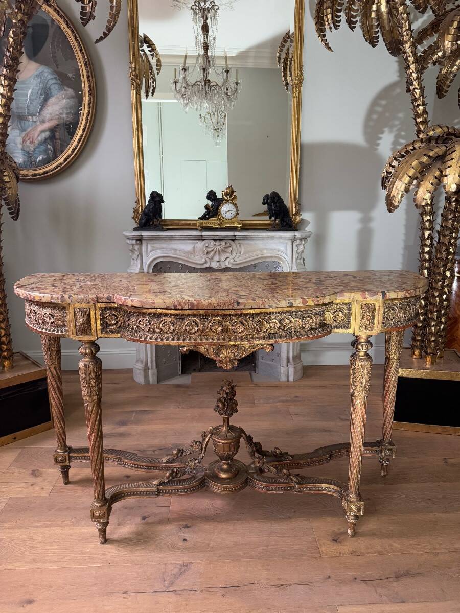 Console with 4 legs from the end of the 19th century in gilded wood in the Louis XVI style.