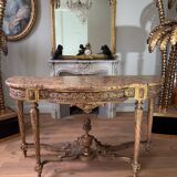 Console with 4 legs from the end of the 19th century in gilded wood in the Louis XVI style.