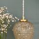 Suspension globe vintage en verre moulé ambré
