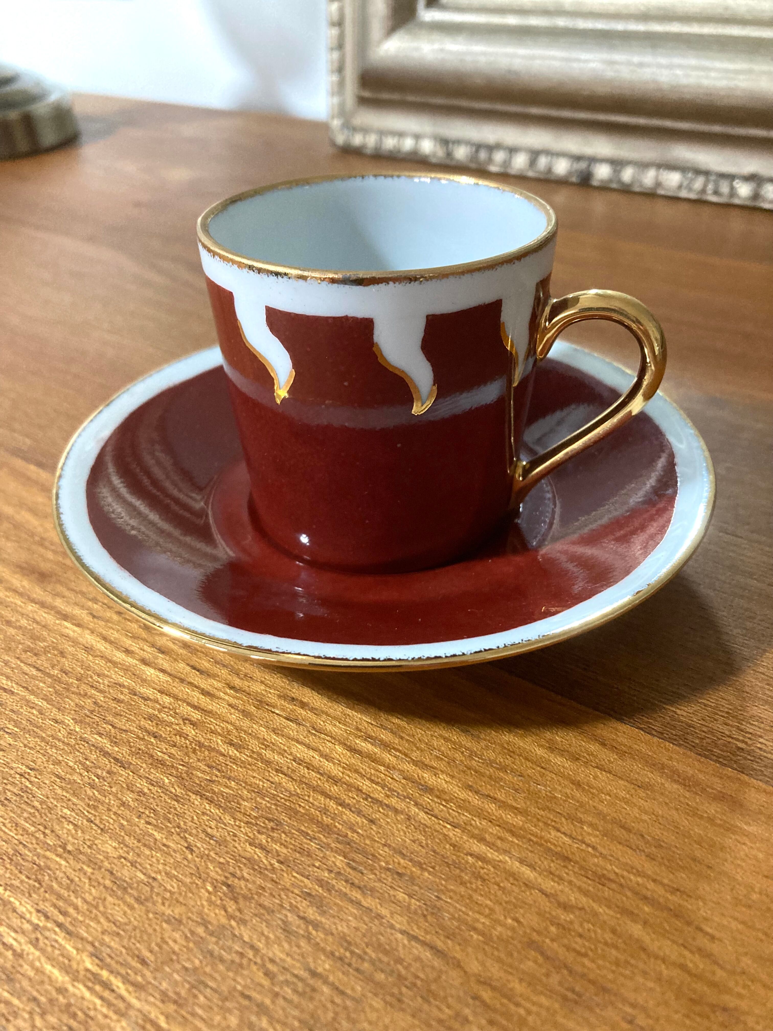 Hand-painted Limoges porcelain cup and saucer signed R. Blier