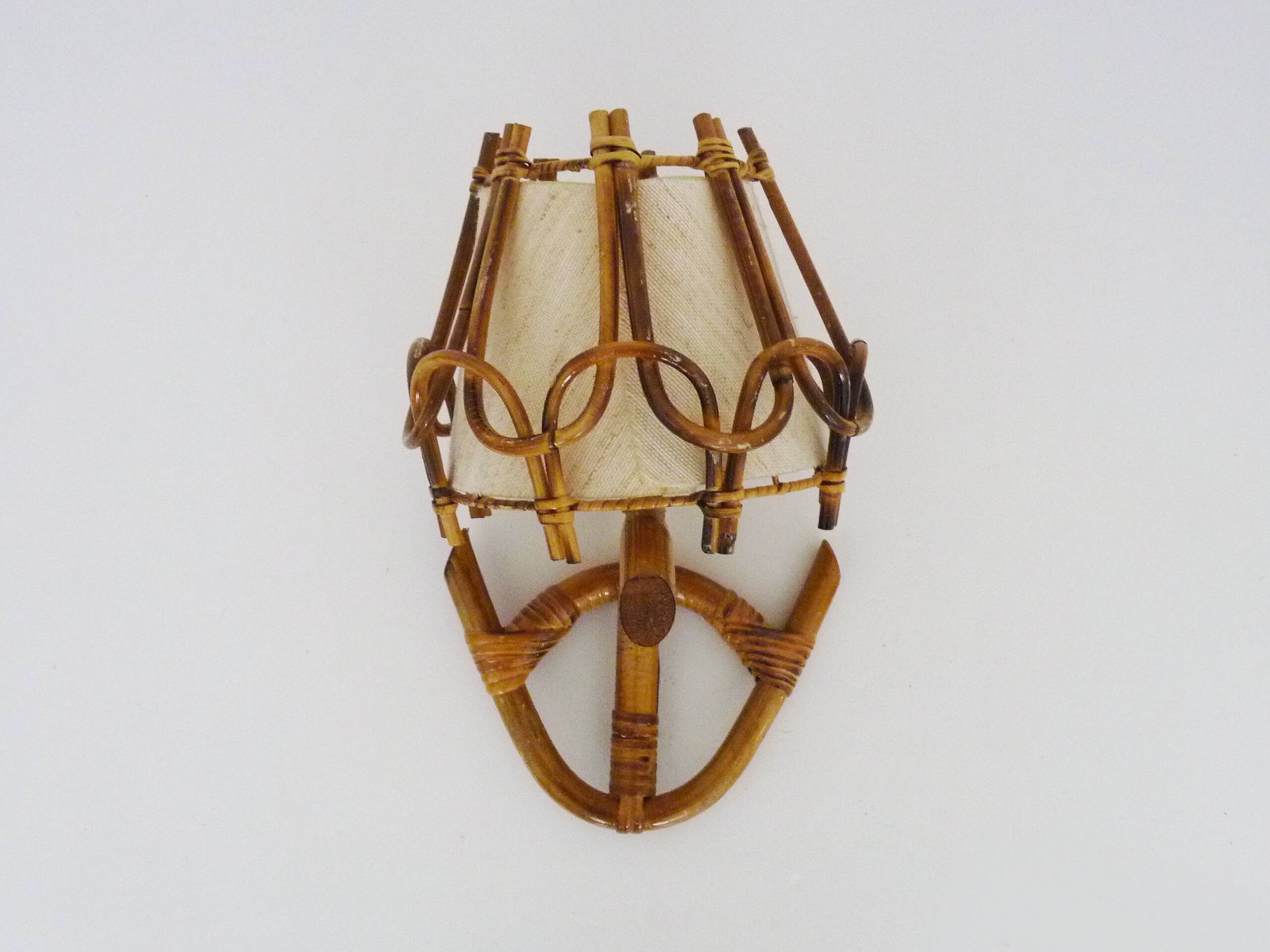 Louis Sognot rattan and bamboo wall light. 1950s