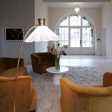 Curved mid-century floor lamp in brass and stone