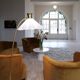 Curved mid-century floor lamp in brass and stone