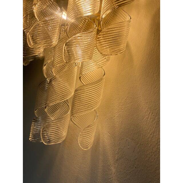 A pair of contemporary transparent “ricci” murano glass wall sconces