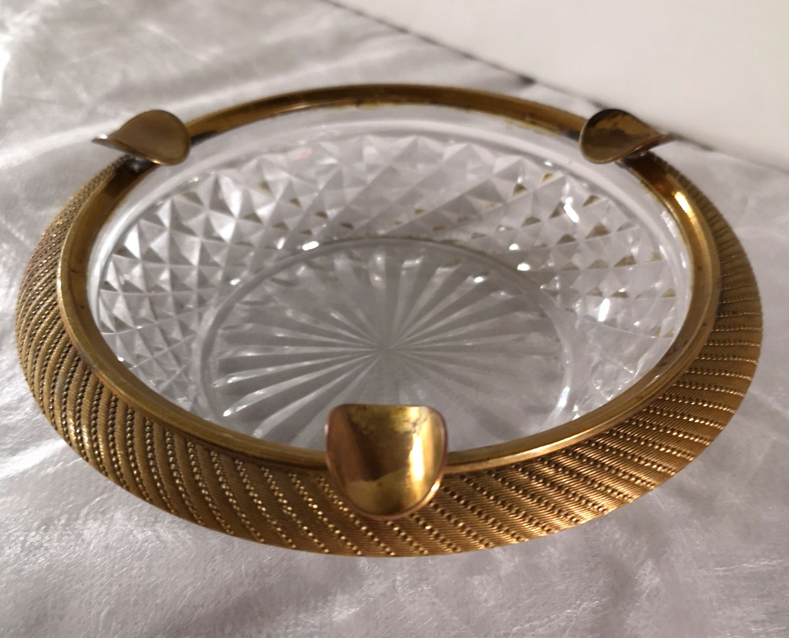 Cut glass and brass ashtray