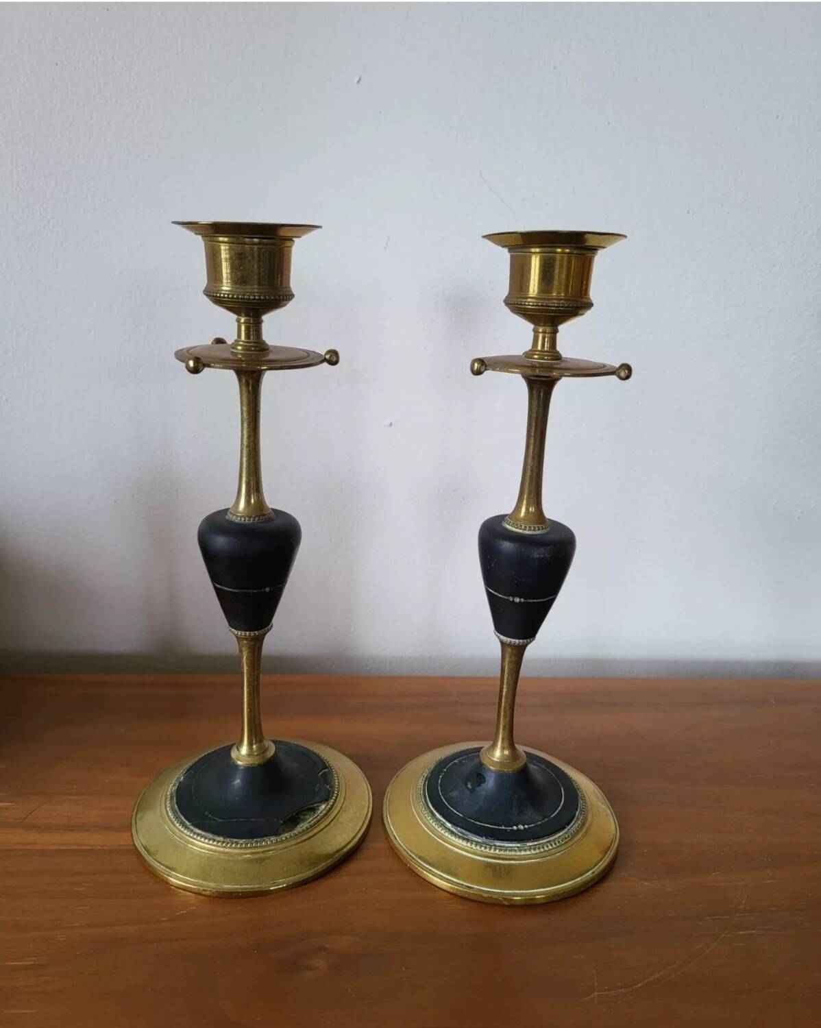 Pair of brass and black hard stone candlesticks