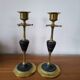 Pair of brass and black hard stone candlesticks