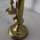 Pair of brass pusher candlesticks