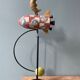 Old painted sheet metal pendulum toy