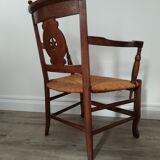 Straw armchair folk art.
