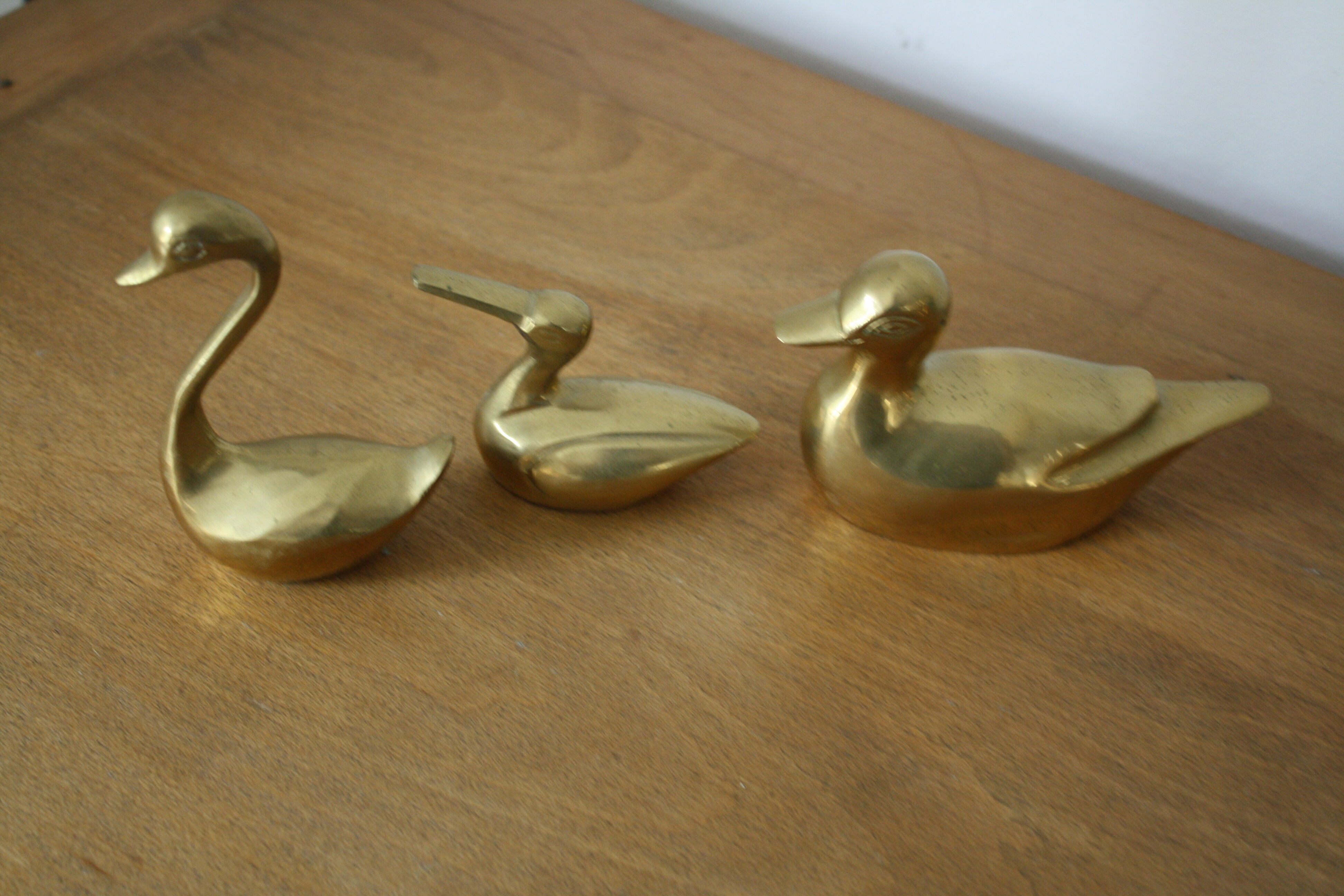 Set of 2 ducks and 1 brass swan