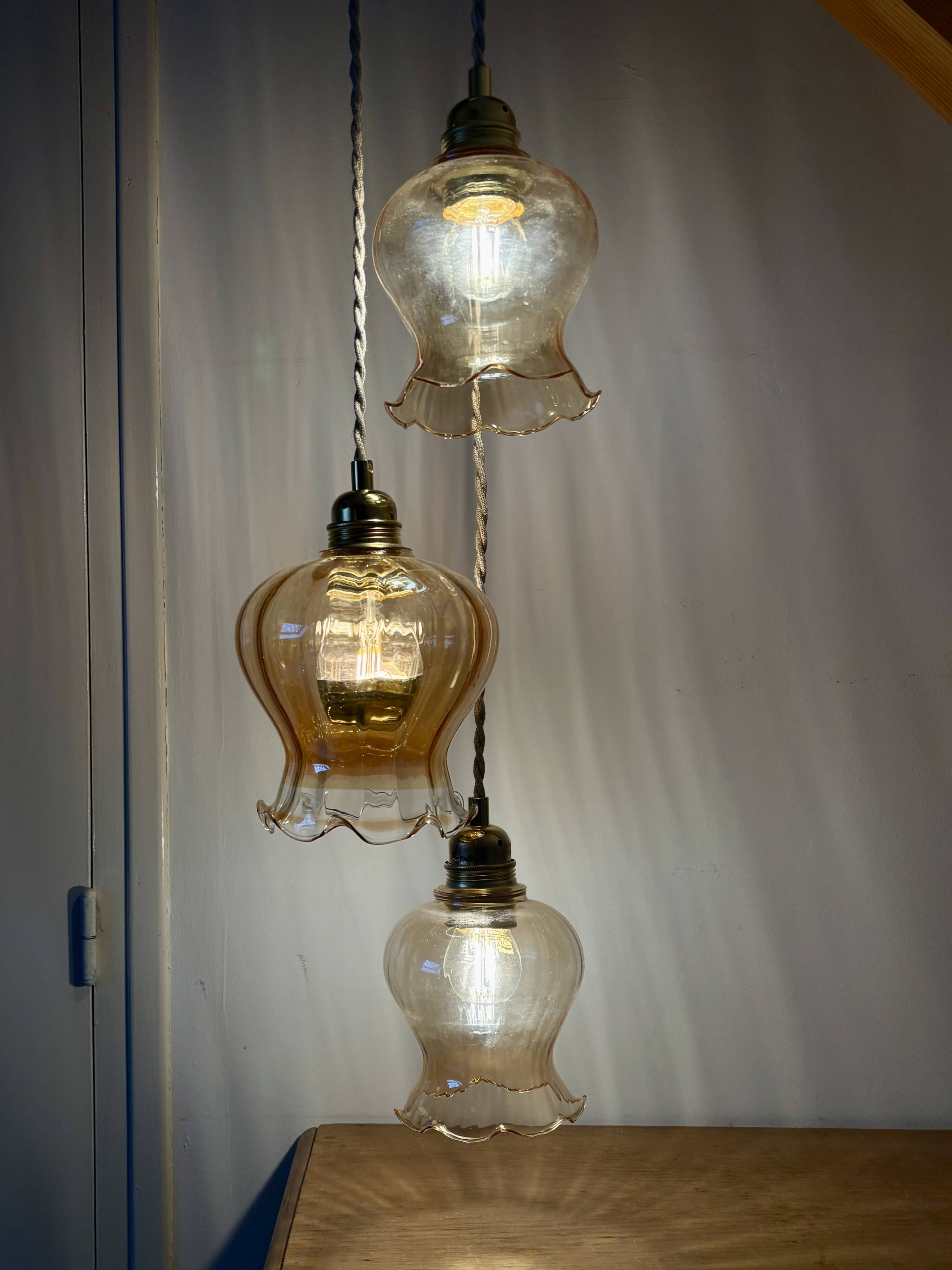 Triple vintage tulip pendant light in amber glass