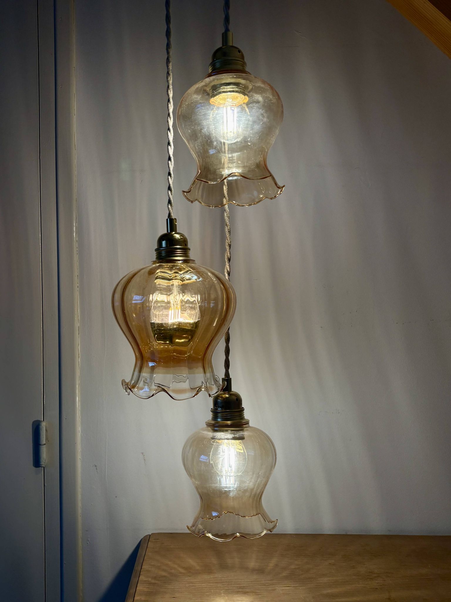 Triple vintage tulip pendant light in amber glass