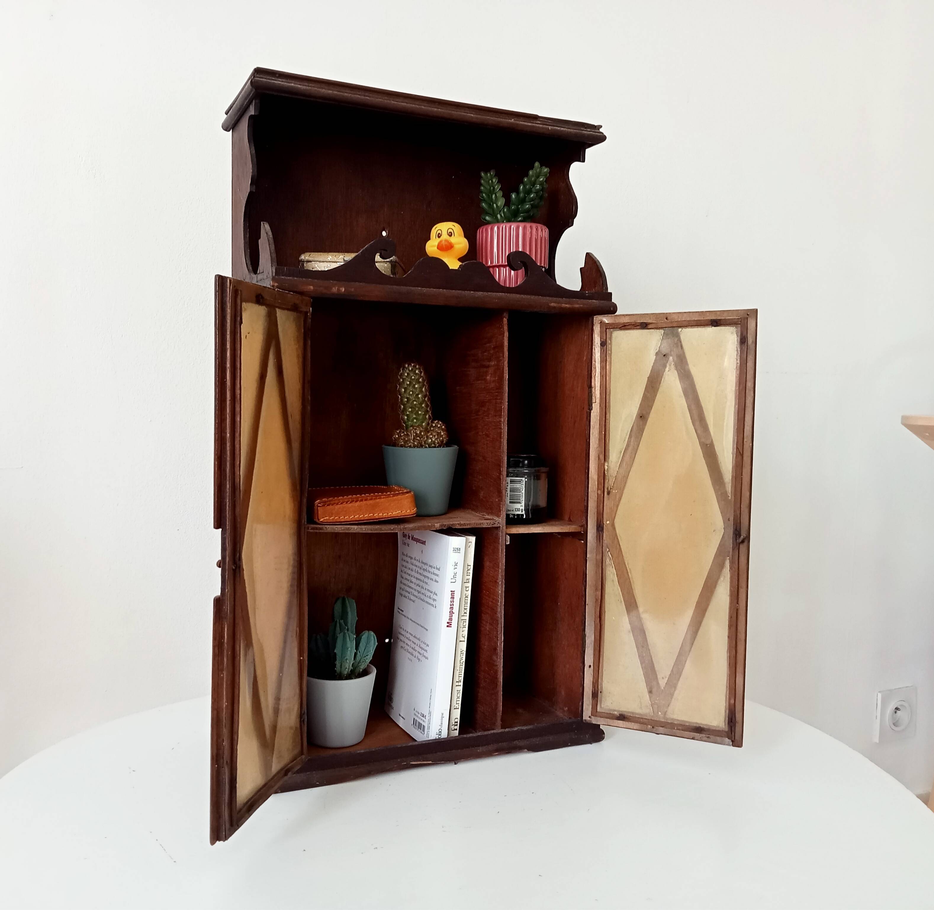 Small antique wall cabinet in Gothic style.