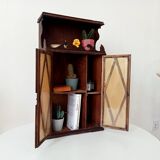 Small antique wall cabinet in Gothic style.